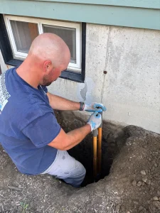 Foundation Crack Seal professional inspecting a foundation