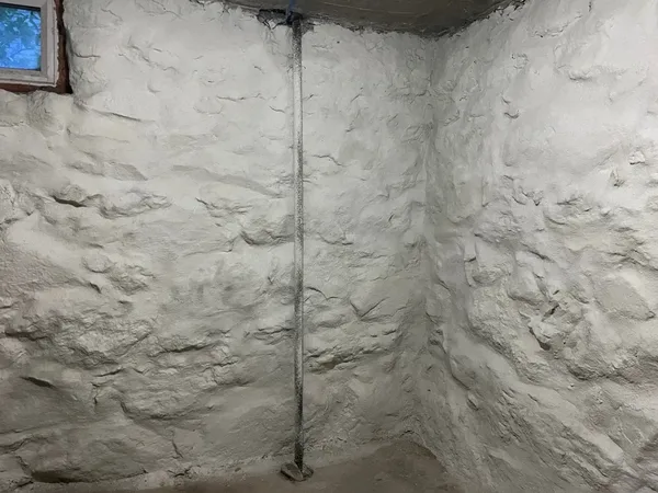 Stone foundation wall restoration completed