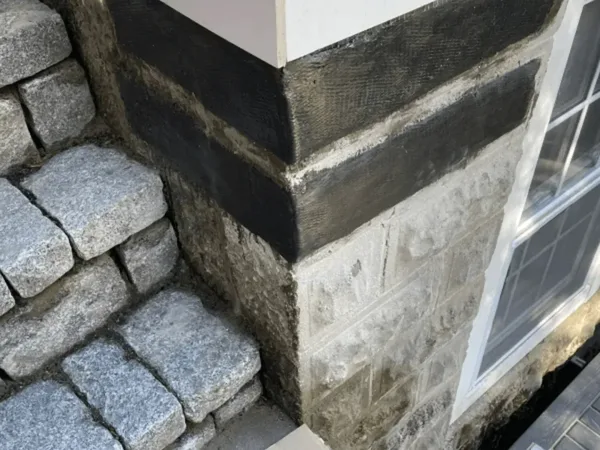 Historic fieldstone foundation after mortar repointing