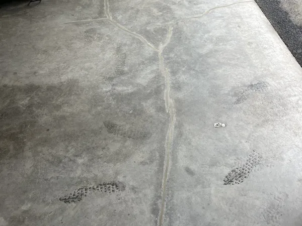The same garage floor crack after flexible sealant repair