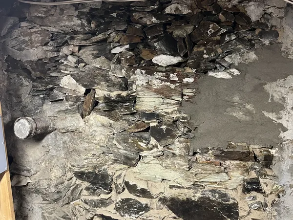 Deteriorated fieldstone foundation wall in Newton before mortar repair