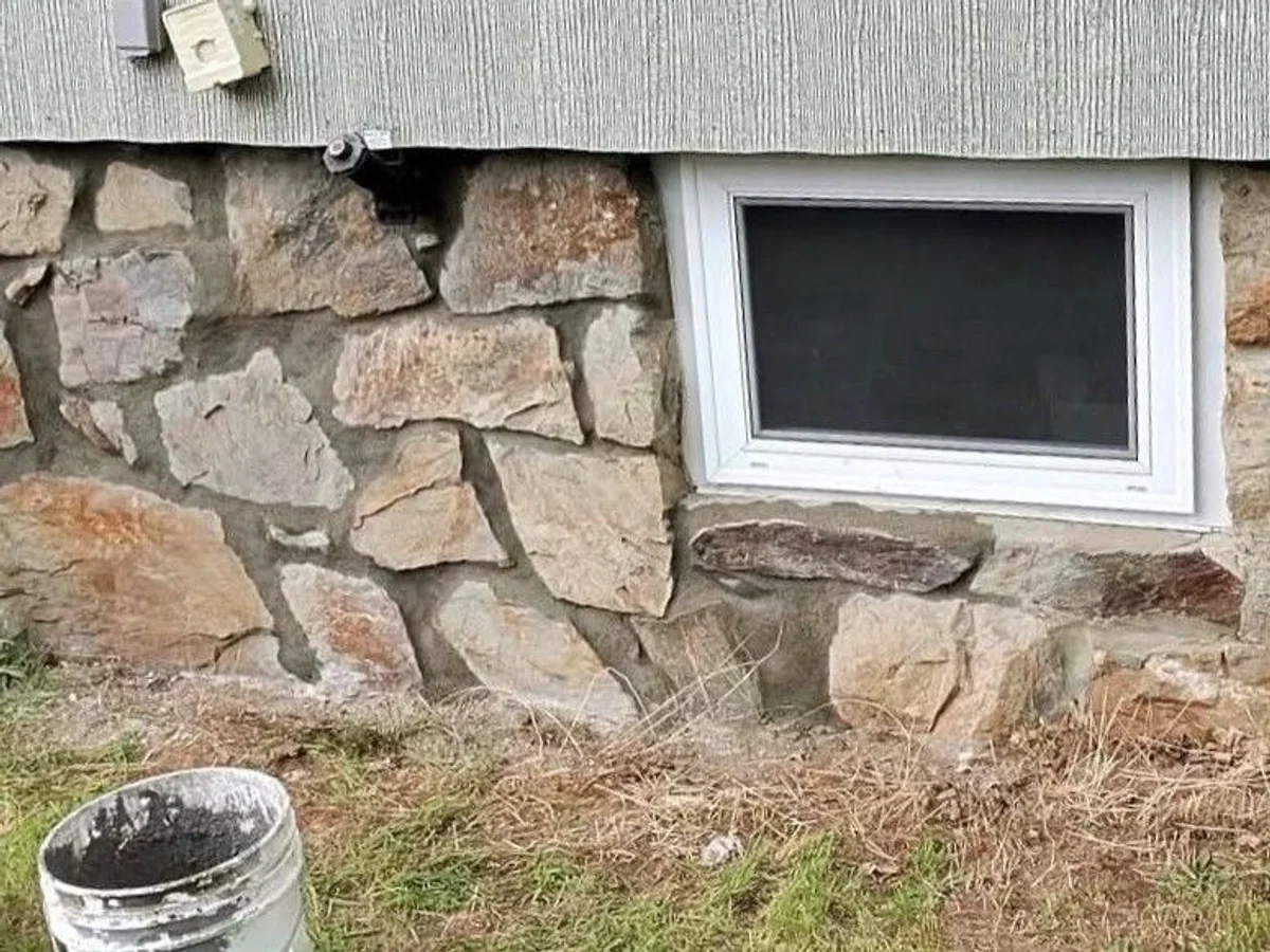 Stone foundation after professional repointing with fresh mortar by Foundation Crack Seal